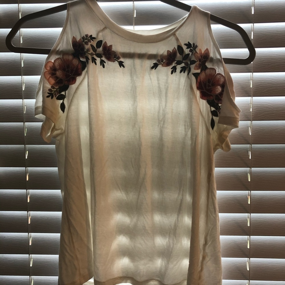 A white off the shoulder tee shirt.